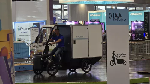 Cargo bike PACK at the IAA Transportation Expo with a rider on the test track